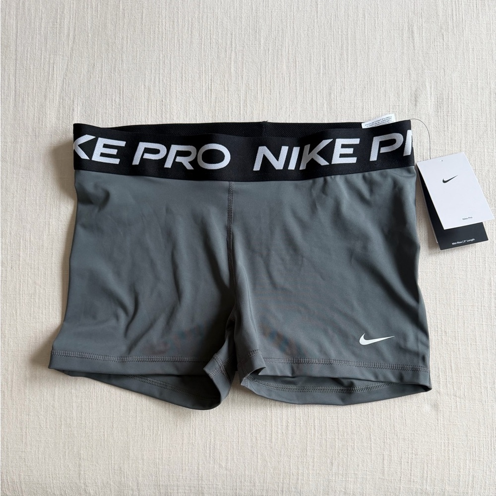 Nike Pro Women's Grey Athletic Compression Shorts with Black Branded Waistband